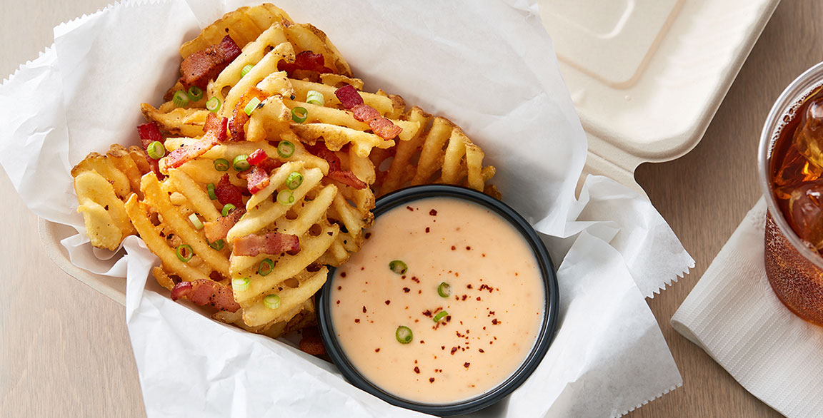 Crispy Waffle Fries Poutine with Spicy Cheese Sauce