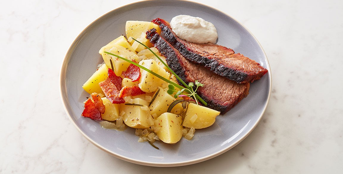 Warm German Idaho® Potato Salad with Smoked Brisket