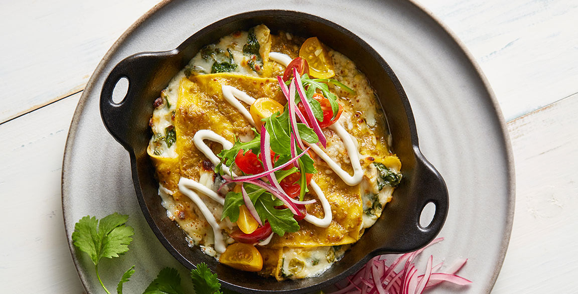 Cheesy Cal-Mex Spinach and Artichoke Enchiladas