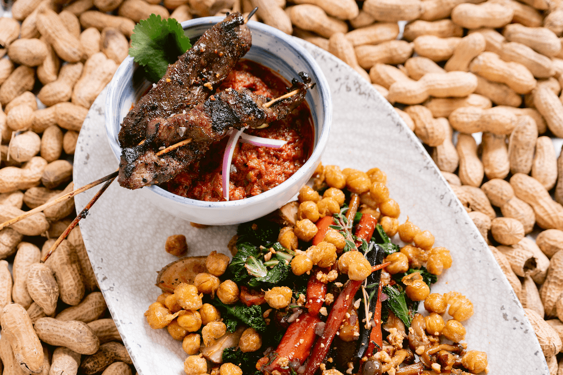 Suya Beef Skewers Over Maafe Peanut Stew