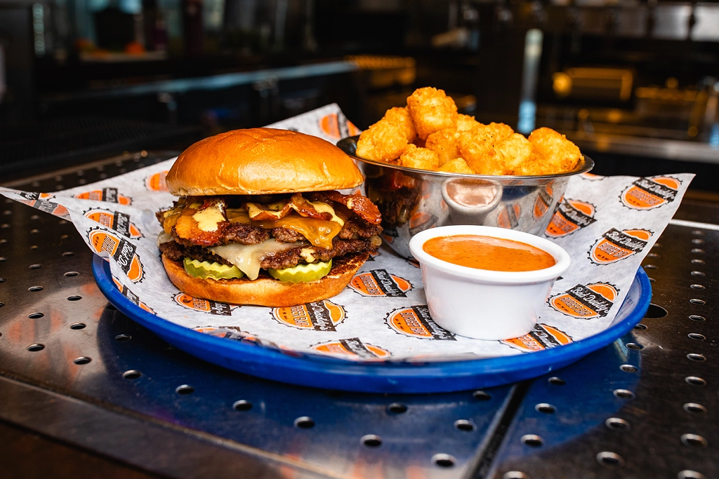 The Smash N’ Stack Burger is the latest addition to Bad Daddy’s permanent lineup. Featuring two 4-oz. patties, bacon, lettuce and cheddar, its size and simple build is the culmination of menu evolution and customer feedback.