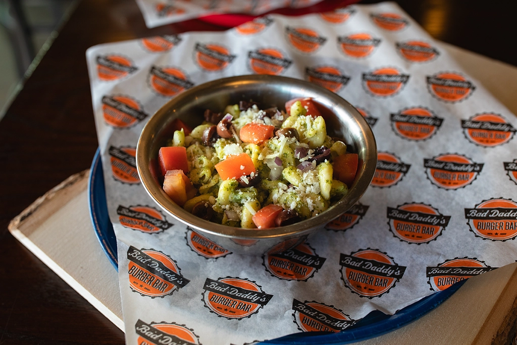 Now a permanent offering, the Pesto Pasta Salad cross-utilizes existing ingredients for a side option that performs as well off-premises as it does at the restaurant.